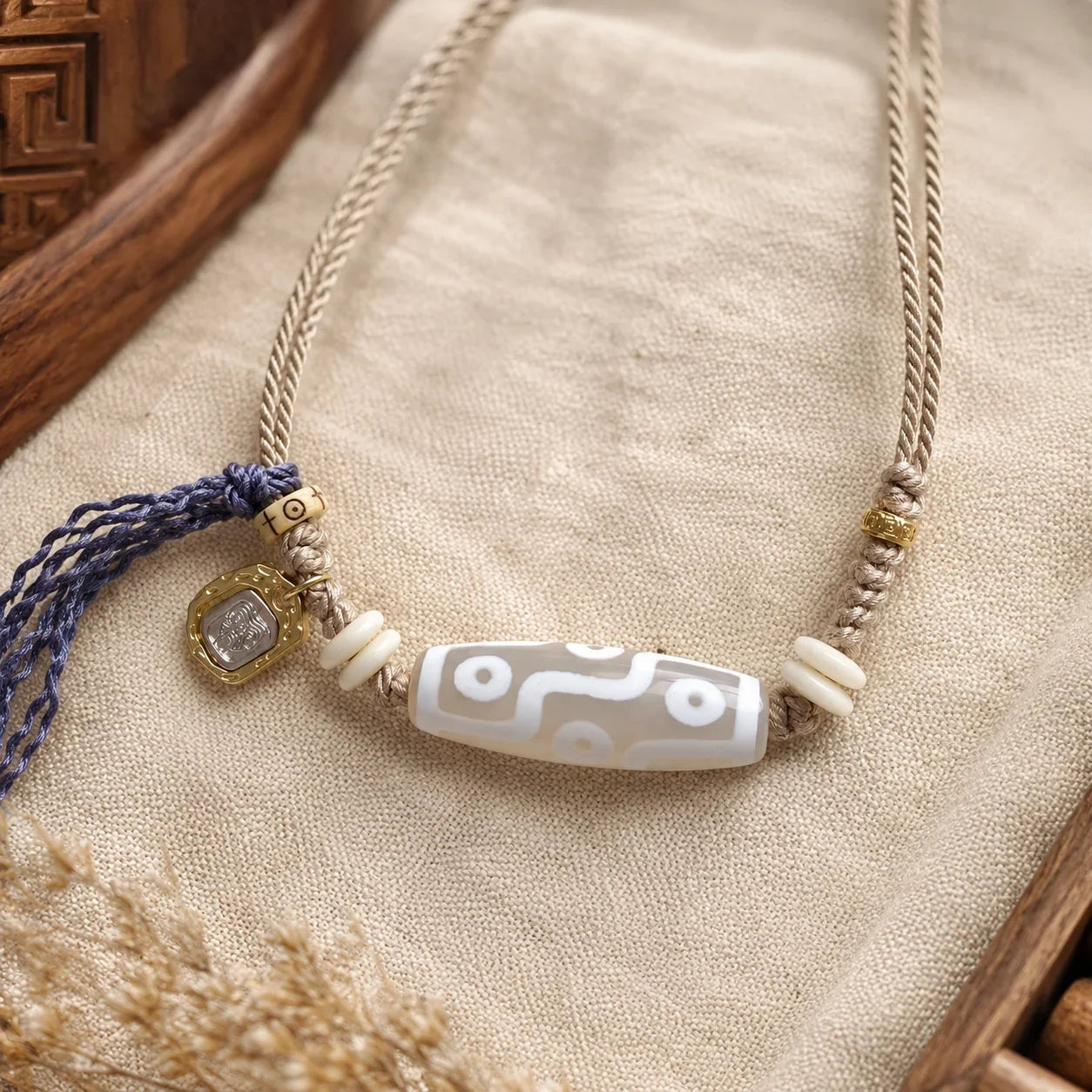 Tibetan-inspired Dzi necklace for comparison with Dzi bracelets