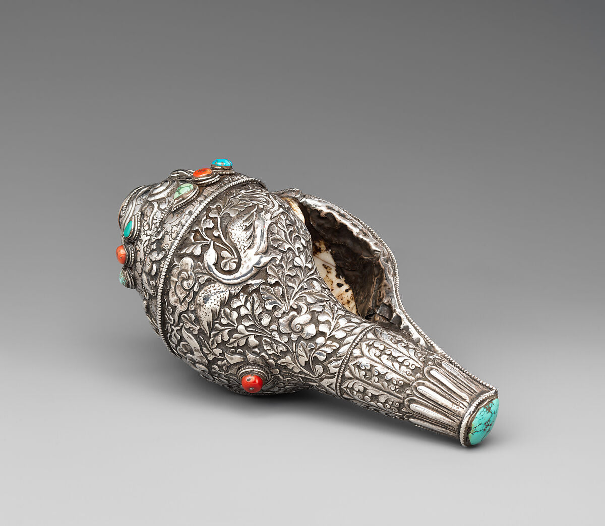 Tibetan ritual conch shell trumpet decorated with silver, turquoise, and coral