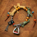 Handcrafted cord and bead details on Medicine Buddha Gau Amulet Bracelet thumbnail 4 | Kailora