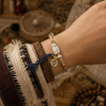 Tibetan-Inspired Dzi Agate Cord Bracelet with Zaki Lhamo Charm | Kailora thumbnail 7 | Kailora