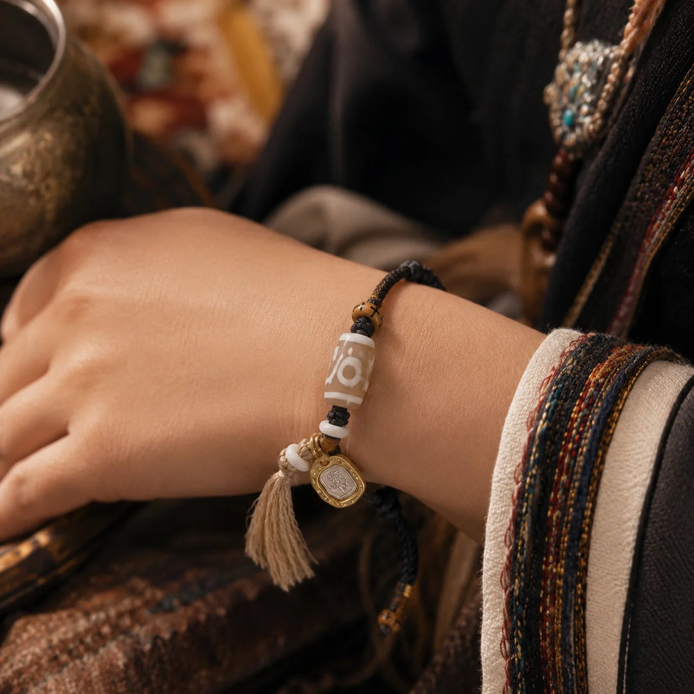 Kailora Tibetan Noble Dzi Agate Cord Bracelet with Zaki Lhamo Prosperity Charm detail view 8 | Kailora