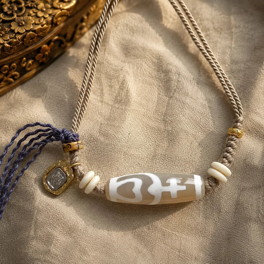 Tibetan-Inspired Dzi Agate Cord Necklace with Zaki Lhamo Charm | Kailora detail view 16 | Kailora