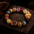 Kailora Abundance Mosaic natural crystal bracelet on carved dark wood thumbnail 2 | Kailora