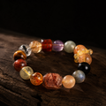 Kailora Abundance Mosaic natural crystal bracelet on weathered wood with dark background thumbnail 1 | Kailora