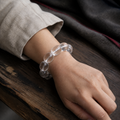 Himalayan clear quartz bracelet worn on wrist with hand-finished barrel beads thumbnail 6 | Kailora