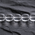 Close-up of high-clarity hand-polished clear quartz barrel beads thumbnail 4 | Kailora