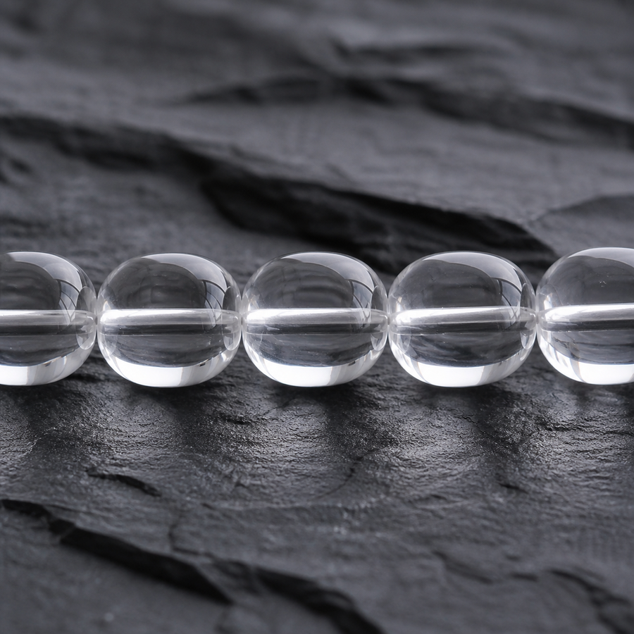 Close-up of high-clarity hand-polished clear quartz barrel beads detail view 4 | Kailora