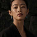 Woman wearing Kailora asymmetric turquoise designer earrings thumbnail 3 | Kailora