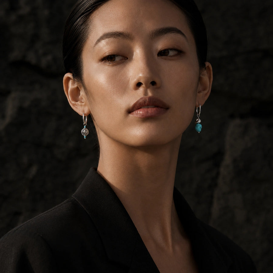 Woman wearing Kailora asymmetric turquoise designer earrings detail view 3 | Kailora