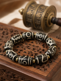 Close-up of natural agate Dzi bead details on Kailora bracelet thumbnail 2 | Kailora