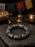 Elastic stretch cord and natural agate Dzi bead details on Kailora bracelet thumbnail 4 | Kailora