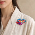 Model wearing Chen Dragon Chinese Zodiac hand-embroidered cotton-linen brooch handcrafted in Tibet thumbnail 26 | Kailora