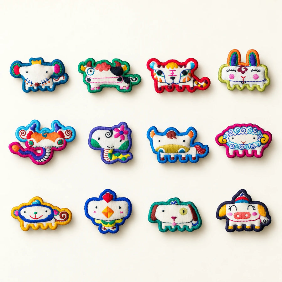 Twelve Chinese Zodiac hand-embroidered textile brooches handcrafted in Tibet detail view 1 | Kailora