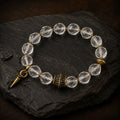 Tibetan-inspired clear quartz bracelet displayed on dark slate thumbnail 5 | Kailora