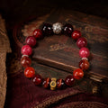 Dog and Pig Chinese zodiac crystal bracelet in a Tibetan-inspired Kailora still-life setting thumbnail 1 | Kailora