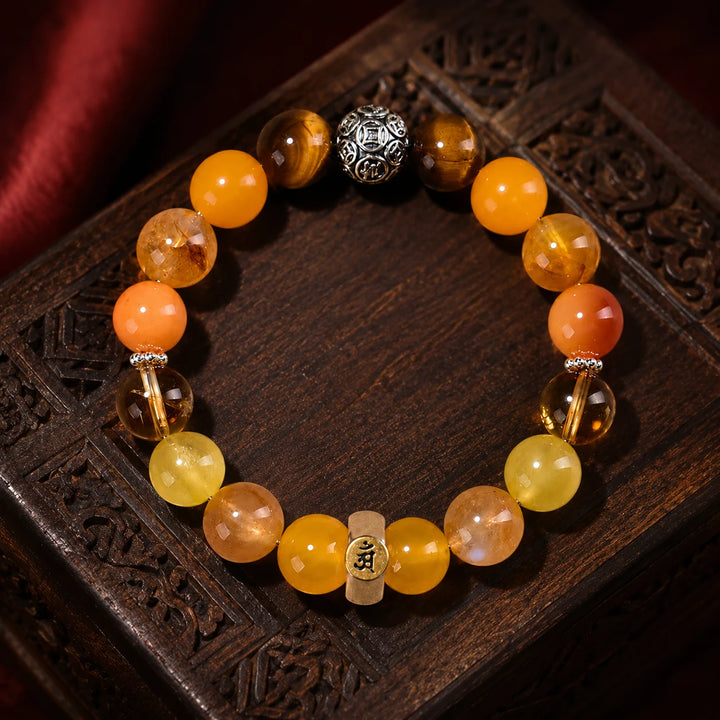 Kailora Dragon and Snake Chinese zodiac crystal bracelet handmade in Tibet with natural golden stones