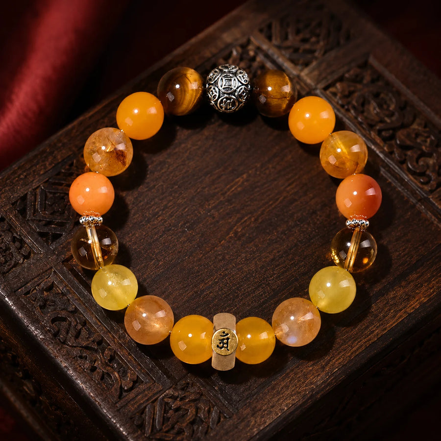 Kailora Dragon and Snake Chinese zodiac crystal bracelet handmade in Tibet with natural golden stones detail view 1 | Kailora