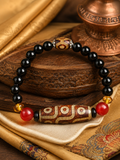 Close-up of Dzi-style agate bead details on Kailora bracelet thumbnail 2 | Kailora