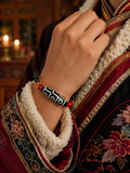 Braided cord and agate Dzi bead details on Kailora intuition bracelet thumbnail 4 | Kailora