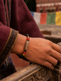 Lifestyle close-up of Kailora agate Dzi bead bracelet thumbnail 9 | Kailora