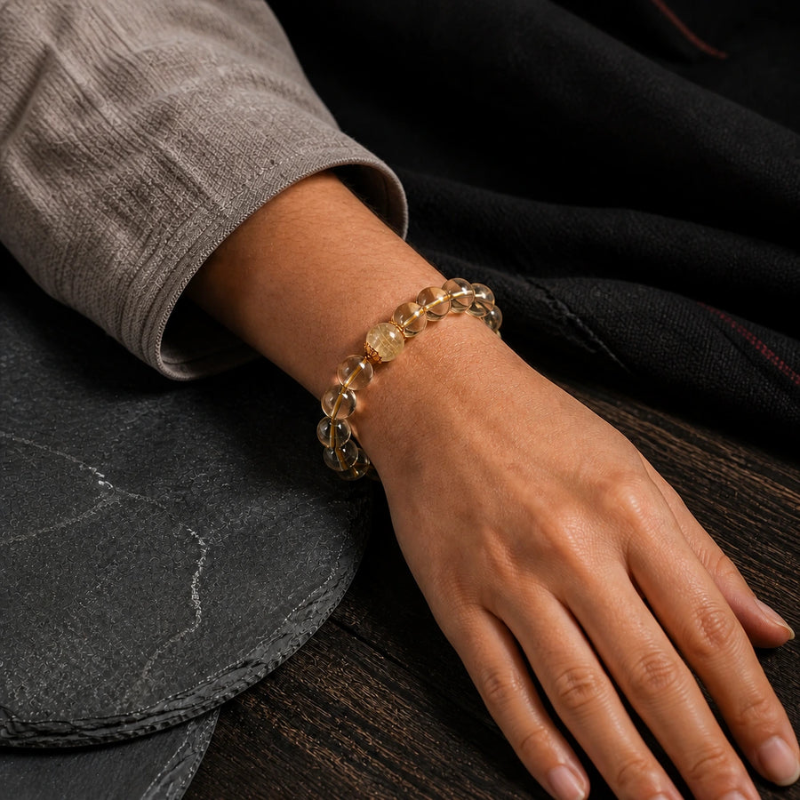 Golden Intention citrine bracelet worn on wrist with warm golden crystal beads detail view 2 | Kailora