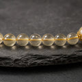 Macro detail of natural citrine beads with translucent golden tones and natural inclusions thumbnail 5 | Kailora