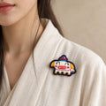 Model wearing Hai Pig Chinese Zodiac hand-embroidered cotton-linen brooch handcrafted in Tibet thumbnail 33 | Kailora