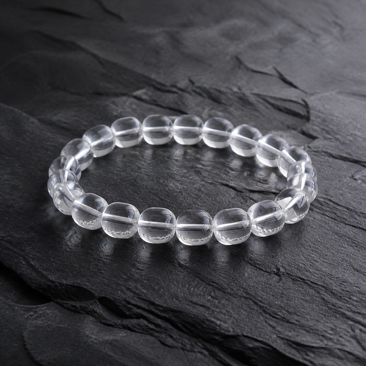 Kailora Himalayan Clarity handcrafted natural clear quartz bracelet on dark stone