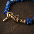 Close-up detail of lapis lazuli beads and brass centerpiece thumbnail 4 | Kailora
