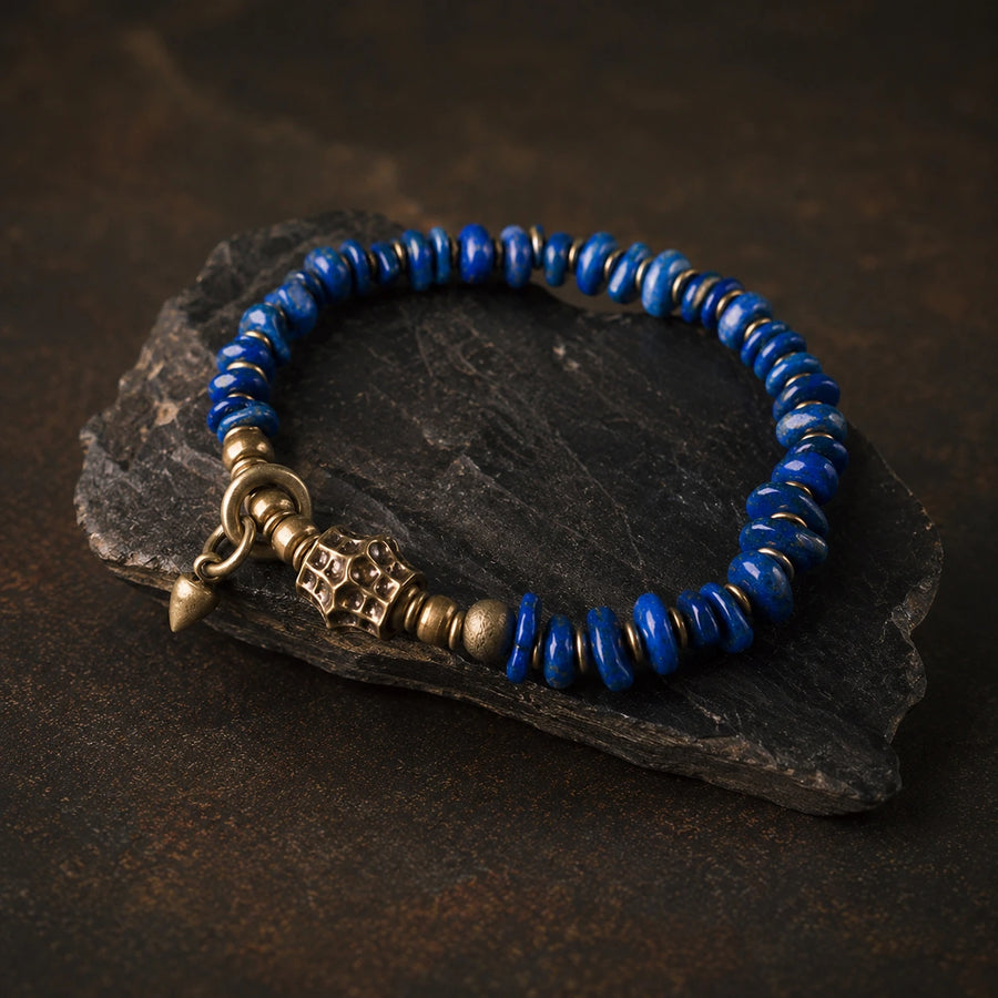 Lapis lazuli and brass bracelet displayed on dark slate detail view 5 | Kailora