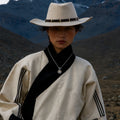 Kailora Mount Kailash pendant necklace styled with black and ivory Tibetan-inspired clothing thumbnail 5 | Kailora