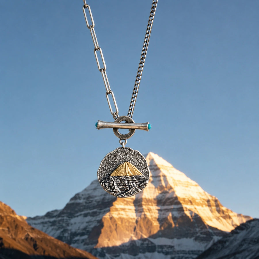 Kailora Mount Kailash necklace pendant aligned with the mountain at golden hour detail view 2 | Kailora