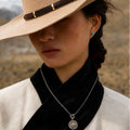 Model wearing Kailora Mount Kailash pendant necklace in a Tibetan-inspired highland setting thumbnail 4 | Kailora