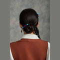 Tibetan handmade purple crystal and turquoise hair clip styled around a low bun thumbnail 12 | Kailora