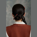 Tibetan handmade Dzi bead hair clip styled around a low bun thumbnail 15 | Kailora