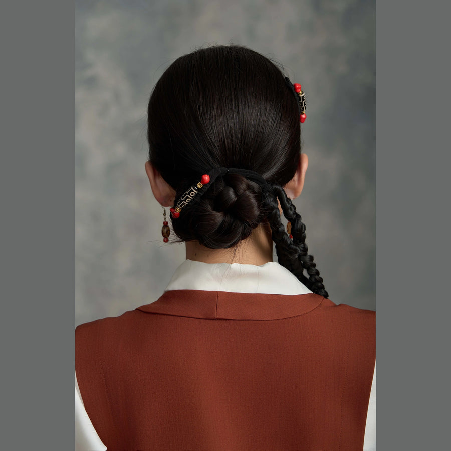 Tibetan handmade Dzi bead hair clip styled around a low bun detail view 15 | Kailora