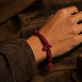 Deep Burgundy Tibetan hemp handwoven bracelet worn on the wrist thumbnail 5 | Kailora