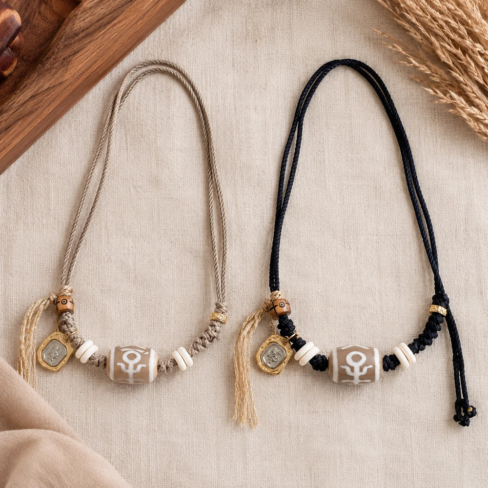 Kailora Tibetan Noble Dzi Agate Cord Necklace with Zaki Lhamo Prosperity Charm detail view 3 | Kailora