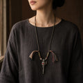 Kailora Tibetan prayer wheel necklace worn with dark linen top thumbnail 5 | Kailora