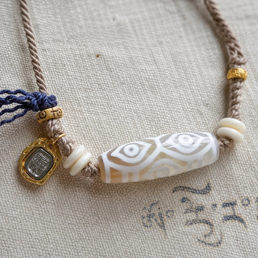 Tibetan-Inspired Dzi Agate Cord Necklace with Zaki Lhamo Charm | Kailora detail view 6 | Kailora