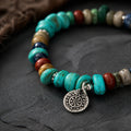 Close-up of turquoise bracelet charm with mixed stone beads and silver-toned details thumbnail 2 | Kailora