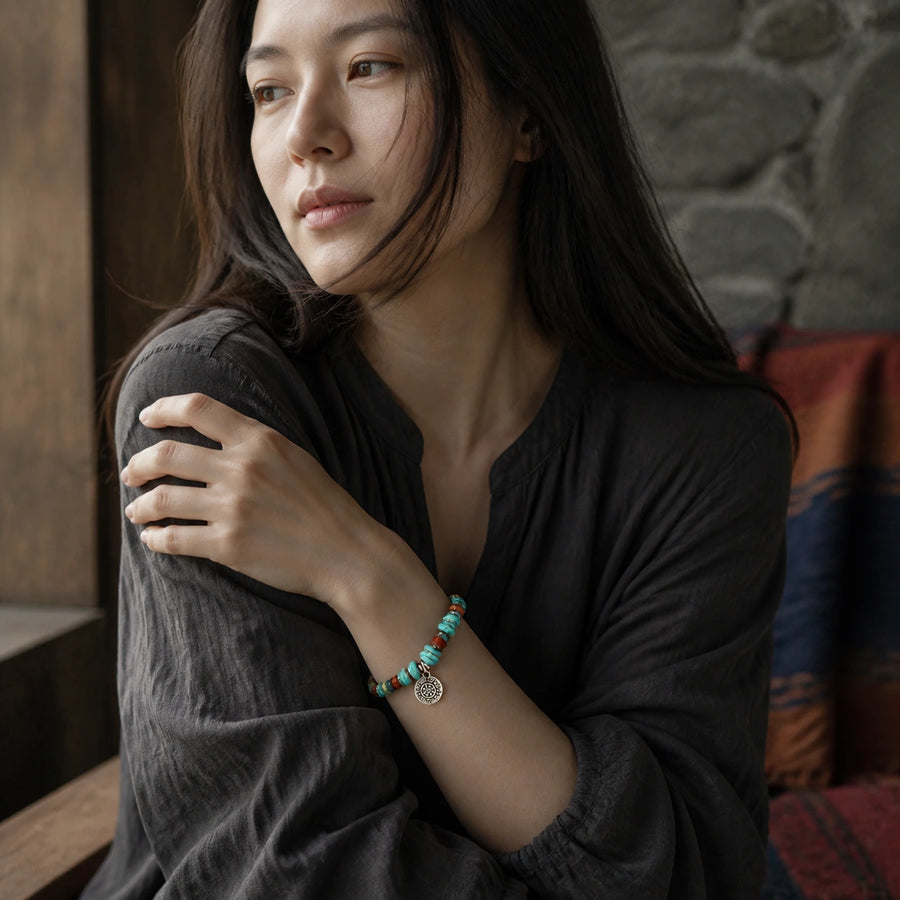 Woman wearing Tibetan-inspired turquoise and mixed stone bracelet by Kailora detail view 4 | Kailora