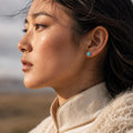 Kailora turquoise stud earring worn on the ear in a Tibetan-inspired portrait thumbnail 2 | Kailora