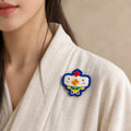 Model wearing You Rooster Chinese Zodiac hand-embroidered cotton-linen brooch handcrafted in Tibet thumbnail 31 | Kailora