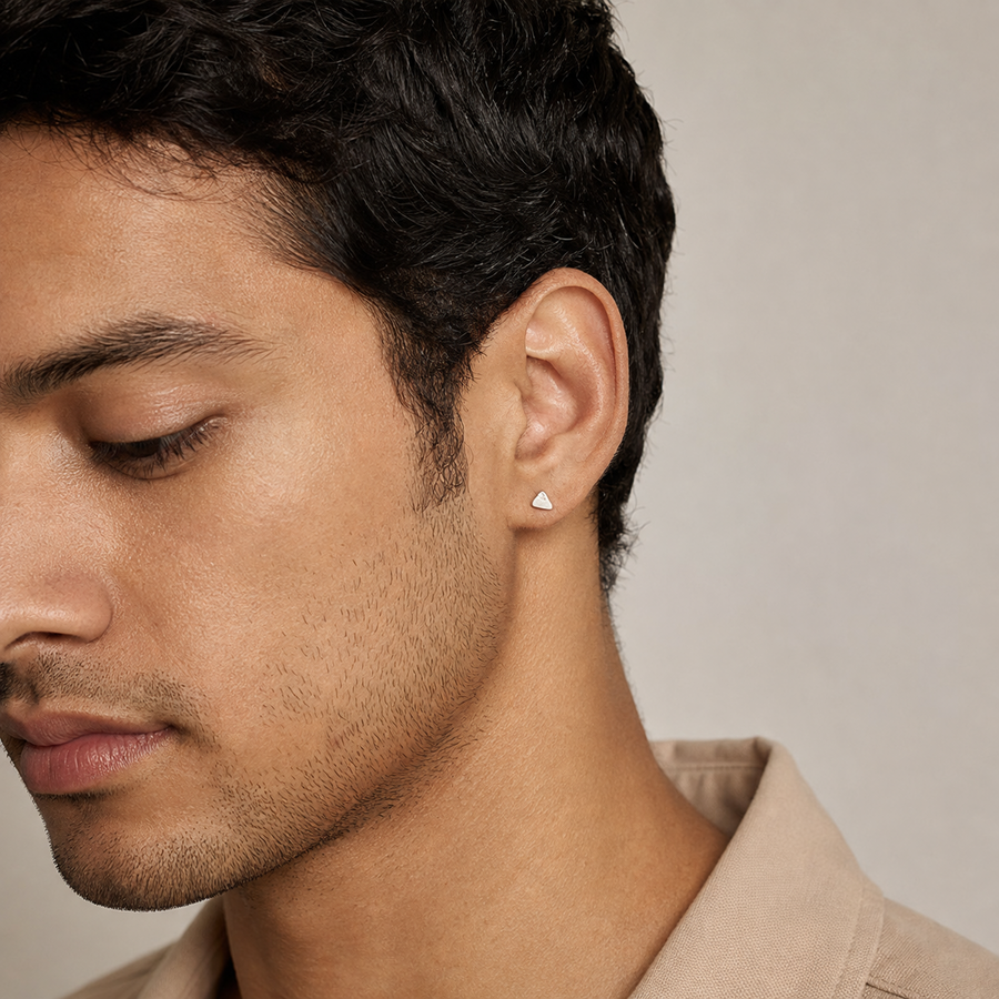 Man wearing petite Mount Kailash silver-tone stud earring detail view 2 | Kailora