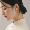 Woman wearing petite Mount Kailash silver-tone stud earring thumbnail 3 | Kailora