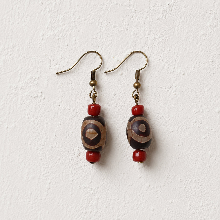 Close-up of natural agate Dzi beads and copper ear hooks on Kailora earrings detail view 3 | Kailora