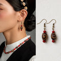 Tibetan-inspired natural agate Dzi bead hook earrings front view by Kailora thumbnail 1 | Kailora