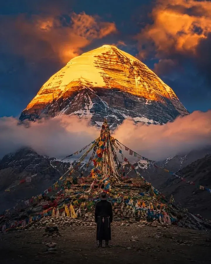 Golden light over Mount Kailash with prayer flags