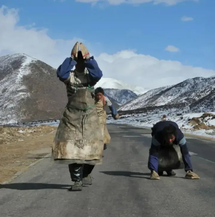 Pilgrims walking on a plateau road